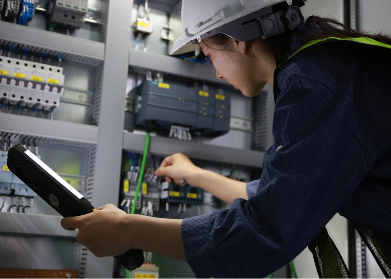 Worker analyzing circuit components